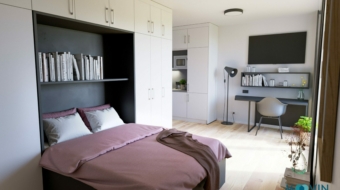 Ein Studentenzimmer mit Bett Schreibtisch TV und Regal